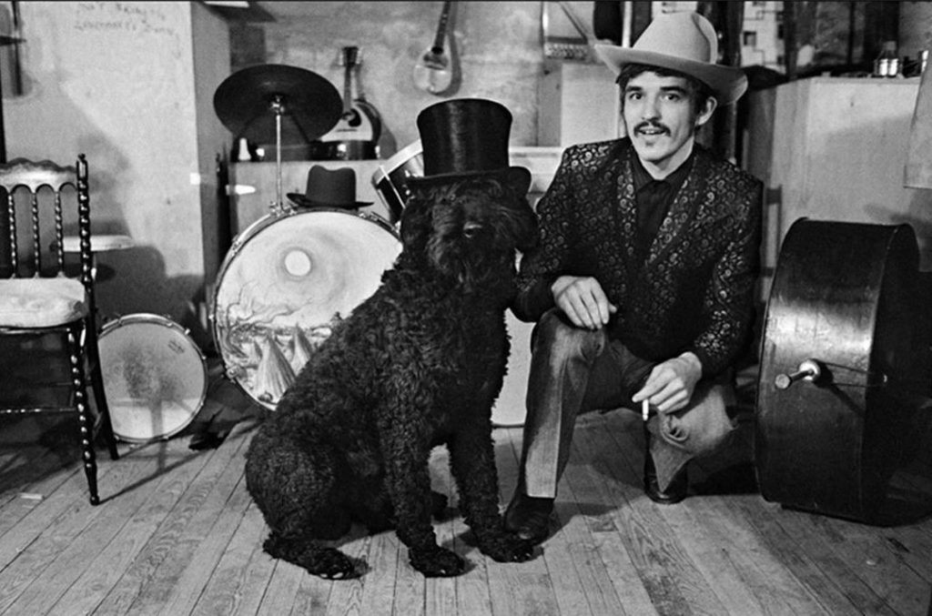 black dog with man in a band